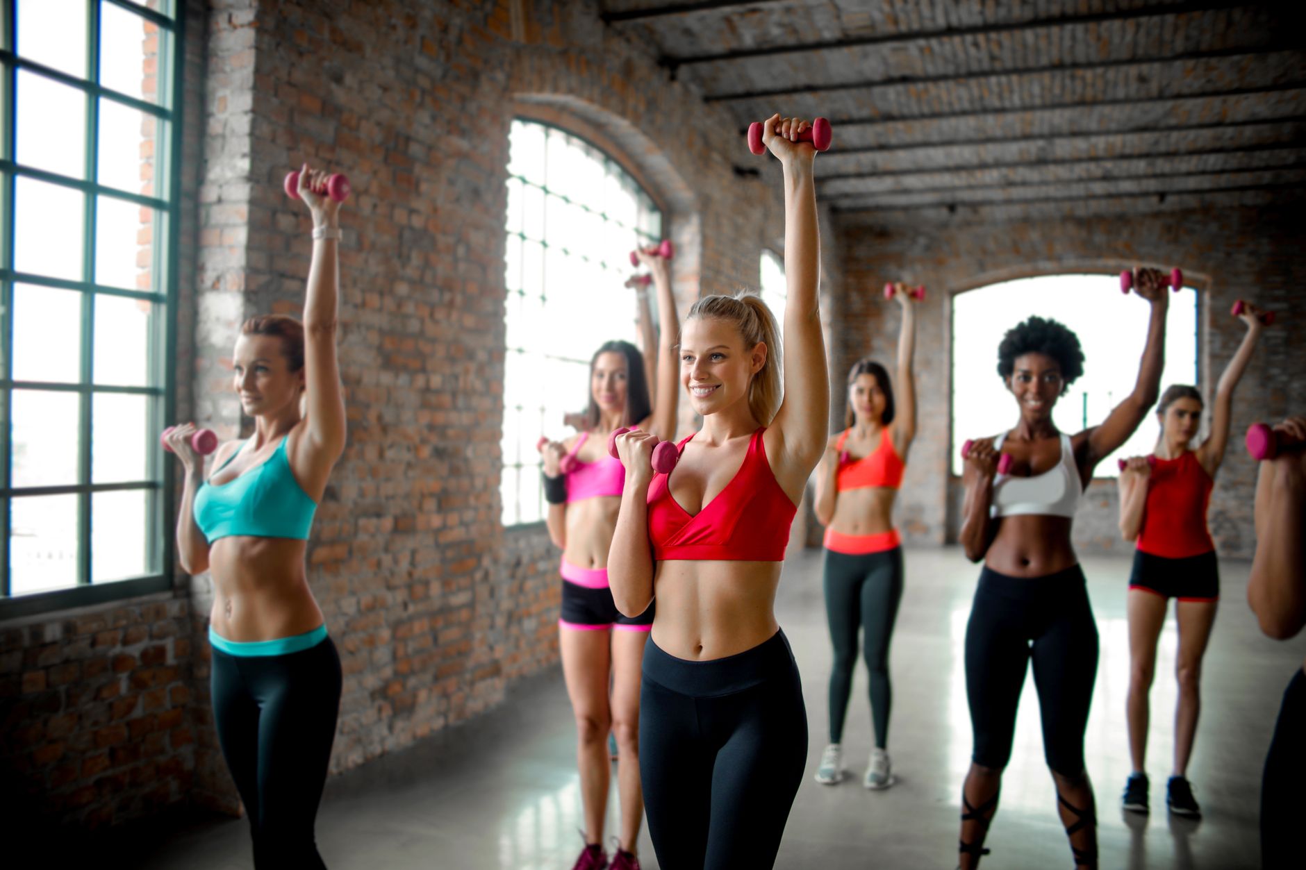Why We Still Run Group Classes in a Gym Full of Barbells